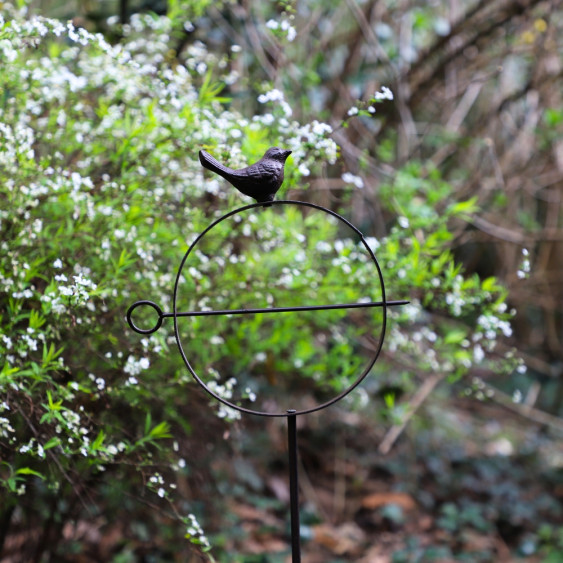 Suspension en fonte avec oiseau