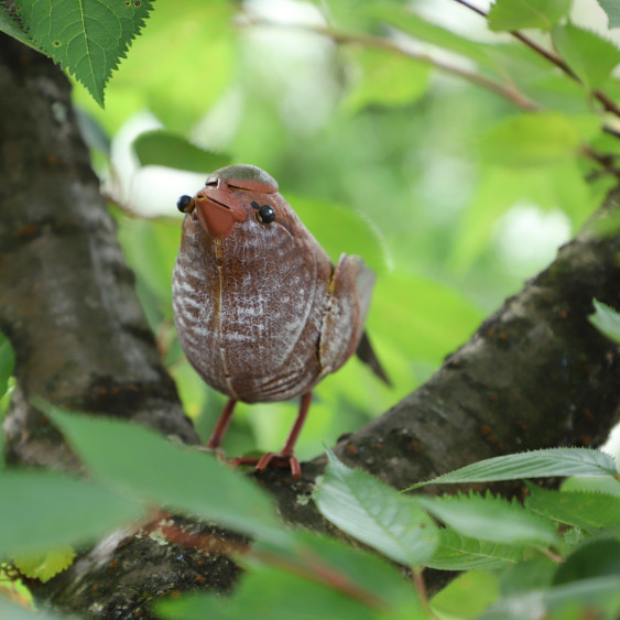 Oiseau en métal rouge/orangé